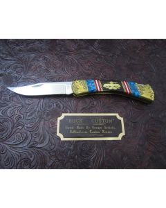 David Yellowhorse Custom Thunderbird 110 Folding Hunter 3.75” mirror polish 420 stainless steel blade. Desert Ironwood handles, with blue turquoise and mother of pearl inlays. Brass bolsters and liners with engravings