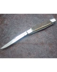 Eye Brand 80’s-90’s era Muskrat display knife 7.125 inch mint condition with Beautiful stag handles and Solingen carbon steel blades with plain blade edges