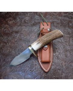 Randall Made Knives A. G. Russell Special Serial number 119 with 4” Carbon steel blade with stag handle Brass and black fiber spacers with a standard single brass hilt